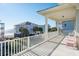 Balcony boasts white railings and partial ocean views at 1681 E Ashley Ave # A & B, Folly Beach, SC 29439