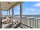 Relaxing oceanfront deck with rocking chairs, offering breathtaking ocean views at 1681 E Ashley Ave # A & B, Folly Beach, SC 29439