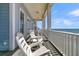Enjoy ocean breezes on this deck overlooking the beach, complete with rocking chairs at 1681 E Ashley Ave # A & B, Folly Beach, SC 29439