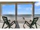 Spacious deck with rocking chairs, enjoying stunning ocean views at 1681 E Ashley Ave # A & B, Folly Beach, SC 29439