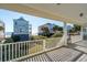 Porch overlooking ocean and neighboring houses at 1681 E Ashley Ave # A & B, Folly Beach, SC 29439