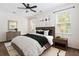 Spacious bedroom with a wooden bed frame and neutral decor at 1762 Bee Balm Rd, Johns Island, SC 29455