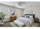 Bedroom with a gray upholstered bed and wooden nightstands at 1762 Bee Balm Rd, Johns Island, SC 29455