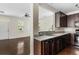 Kitchen with dark brown cabinets, granite countertops, and black appliances at 1762 Bee Balm Rd, Johns Island, SC 29455