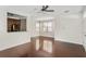 Living room with hardwood floors and a view of the kitchen at 1762 Bee Balm Rd, Johns Island, SC 29455