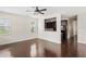Living room with hardwood floors and an open kitchen at 1762 Bee Balm Rd, Johns Island, SC 29455