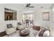 Living room with hardwood floors, a dining area, and a view of the kitchen at 1762 Bee Balm Rd, Johns Island, SC 29455