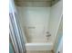 White bathtub and shower with striped curtain at 209 Palmetto Blvd, Edisto Beach, SC 29438
