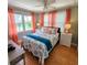 Bedroom with coastal bedding and ocean views at 209 Palmetto Blvd, Edisto Beach, SC 29438