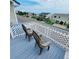Ocean view deck with white lattice and two chairs at 209 Palmetto Blvd, Edisto Beach, SC 29438