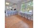 Breakfast bar with metal stools in a bright dining area at 209 Palmetto Blvd, Edisto Beach, SC 29438