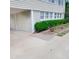 House exterior with driveway and green bushes at 209 Palmetto Blvd, Edisto Beach, SC 29438