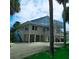 Elevated beach house with parking underneath and a large deck at 209 Palmetto Blvd, Edisto Beach, SC 29438