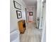 Bright hallway with tile floors and coastal decor at 209 Palmetto Blvd, Edisto Beach, SC 29438