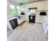 Modern kitchen with stainless steel appliances and white cabinets at 209 Palmetto Blvd, Edisto Beach, SC 29438