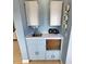 Small kitchenette with sink, mini-fridge, and cabinets at 209 Palmetto Blvd, Edisto Beach, SC 29438