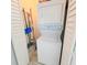Laundry closet with stackable washer and dryer at 209 Palmetto Blvd, Edisto Beach, SC 29438