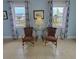Two wicker chairs and a small table in a living room at 209 Palmetto Blvd, Edisto Beach, SC 29438