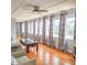 Spacious living room with hardwood floors, large windows and comfortable seating at 209 Palmetto Blvd, Edisto Beach, SC 29438