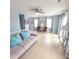 Spacious living room with tiled floor and comfy seating at 209 Palmetto Blvd, Edisto Beach, SC 29438