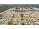 Aerial view of a large community with houses surrounding a central lake at 2186 Midden Dr, Mount Pleasant, SC 29466