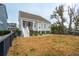 House back exterior, showing a deck and fenced yard at 2186 Midden Dr, Mount Pleasant, SC 29466