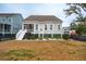 House back exterior, showing a deck and fenced yard at 2186 Midden Dr, Mount Pleasant, SC 29466