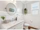 Modern bathroom with white shaker cabinets and marble countertop at 2186 Midden Dr, Mount Pleasant, SC 29466