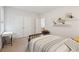 Well-lit bedroom with built-in workspace and double doors at 2186 Midden Dr, Mount Pleasant, SC 29466