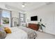 Main bedroom with TV, dresser, and large windows at 2186 Midden Dr, Mount Pleasant, SC 29466