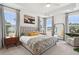 Spacious primary bedroom with large windows and a cozy sitting area at 2186 Midden Dr, Mount Pleasant, SC 29466