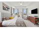 Bright bedroom featuring a king-size bed and built-in dresser at 2186 Midden Dr, Mount Pleasant, SC 29466
