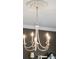 White six-light chandelier in a home office at 2186 Midden Dr, Mount Pleasant, SC 29466
