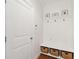 Charming entryway with a built-in bench, storage baskets, and coat hooks at 2186 Midden Dr, Mount Pleasant, SC 29466