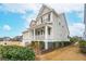 Gray siding two-story house with white trim and a front porch at 2186 Midden Dr, Mount Pleasant, SC 29466