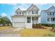 Two-story house with gray siding, white trim, and a front porch at 2186 Midden Dr, Mount Pleasant, SC 29466