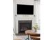 Modern fireplace with white mantel and dark hearth at 2186 Midden Dr, Mount Pleasant, SC 29466