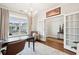 Bright home office features built-in shelving and hardwood floors at 2186 Midden Dr, Mount Pleasant, SC 29466