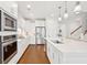 Modern kitchen with white cabinets, stainless steel appliances and island at 2186 Midden Dr, Mount Pleasant, SC 29466