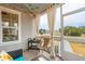 Screened porch with comfortable seating and string lights at 2186 Midden Dr, Mount Pleasant, SC 29466