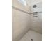 Walk-in shower with built-in shelves and window at 2186 Midden Dr, Mount Pleasant, SC 29466