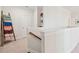 Upstairs hallway with staircase and built-in shelves at 2186 Midden Dr, Mount Pleasant, SC 29466