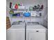 Laundry room with washer, dryer, and shelving at 2345 Tall Sail Dr # C, Charleston, SC 29414