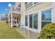 Private patio with seating area adjacent to building exterior at 2345 Tall Sail Dr # C, Charleston, SC 29414
