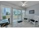 Sunroom with rocking chairs, a desk, and views of the community at 2345 Tall Sail Dr # C, Charleston, SC 29414