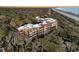 Aerial view of coastal community with oceanfront homes and lush landscaping at 2371 Shipwatch Rd, Kiawah Island, SC 29455