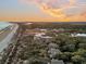 Aerial view of community near beach at sunset at 2371 Shipwatch Rd, Kiawah Island, SC 29455