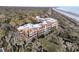 Aerial view of beachfront community nestled amongst trees at 2371 Shipwatch Rd, Kiawah Island, SC 29455