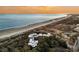Aerial view of beachfront property with ocean and sunset views at 2371 Shipwatch Rd, Kiawah Island, SC 29455