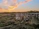 Luxury beachfront building at sunset, offering stunning ocean views at 2371 Shipwatch Rd, Kiawah Island, SC 29455
